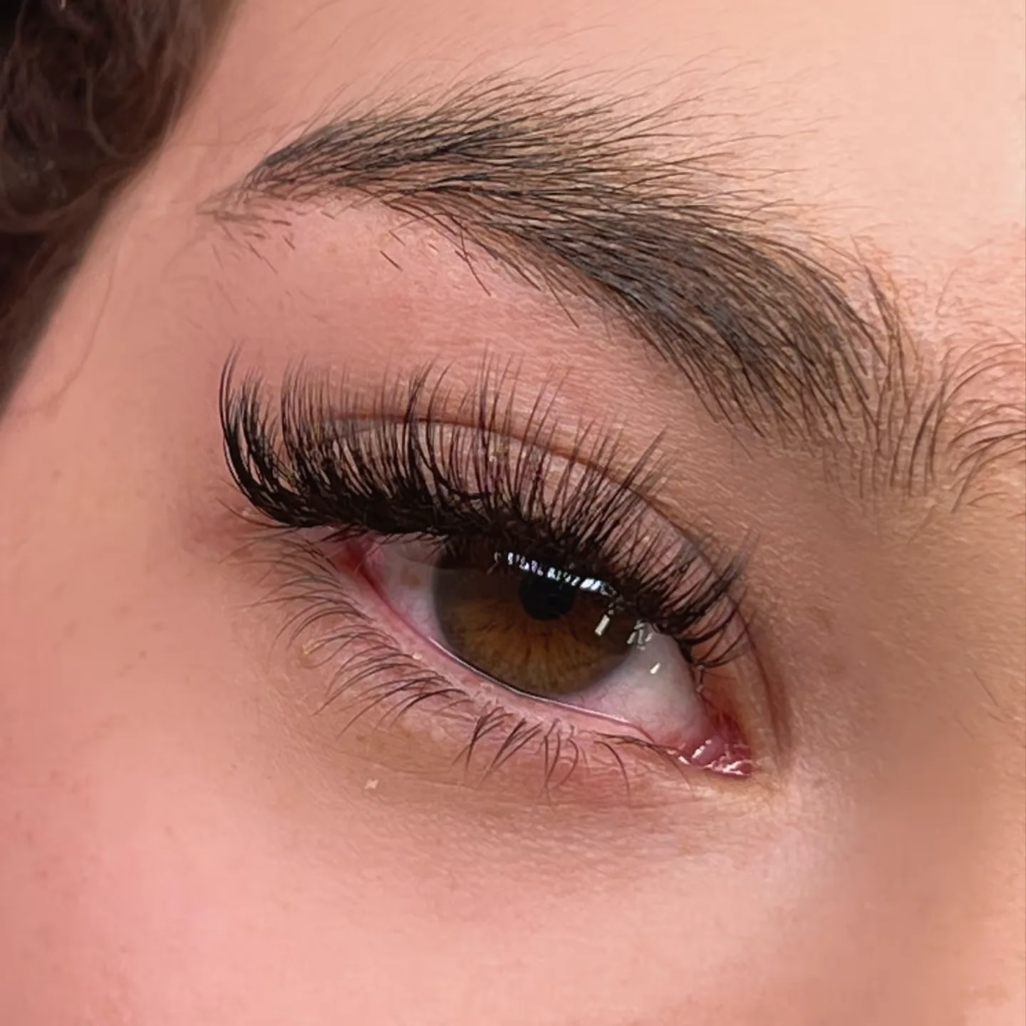 Hybrid eyelash extensions result at Sugaring NYC McKinney — wispy, textured lashes