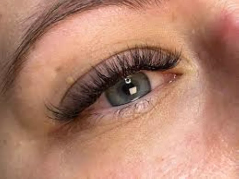 Hybrid eyelash extensions at Sugaring NYC McKinney — dimensional, soft drama lash result