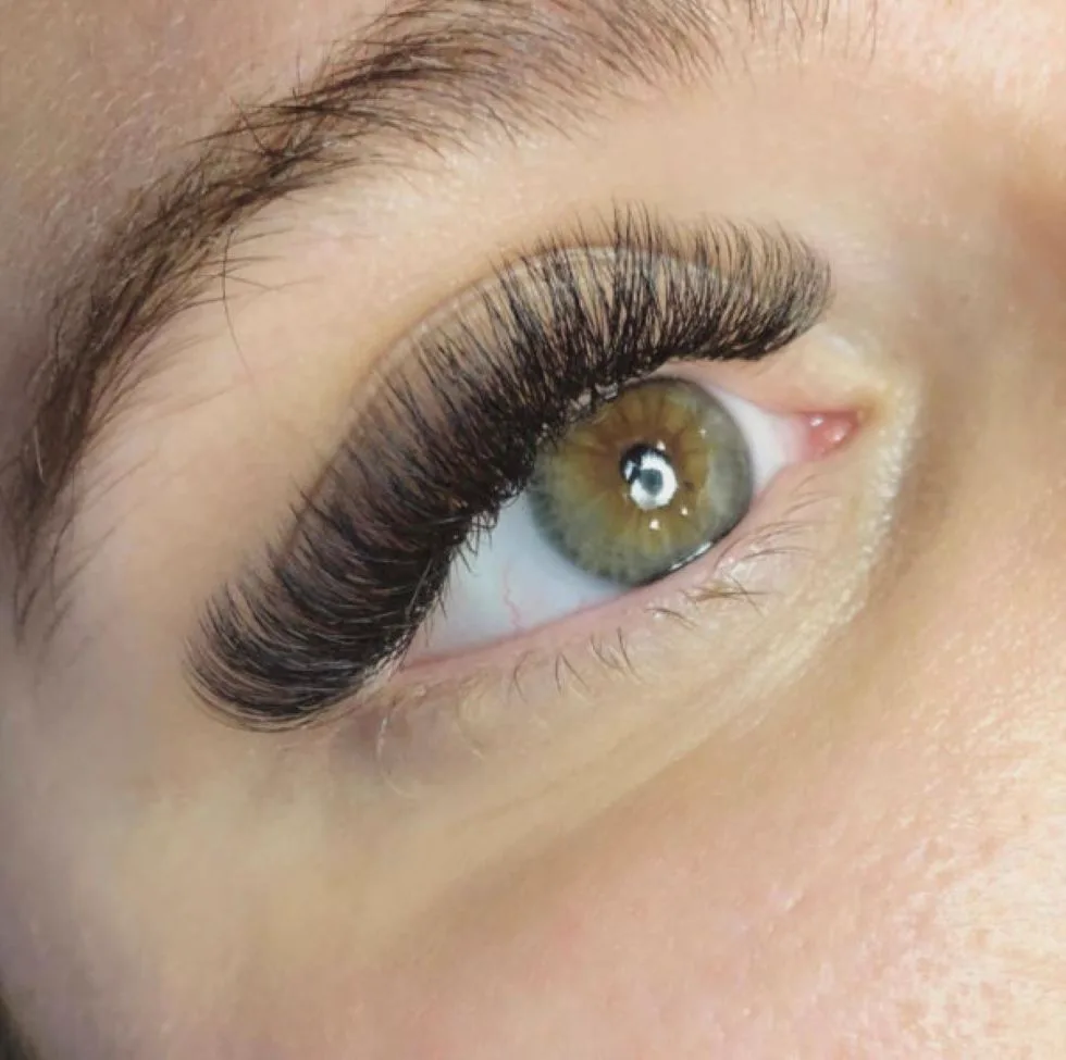 Volume eyelash extensions result at Sugaring NYC McKinney — full, fluffy lashes